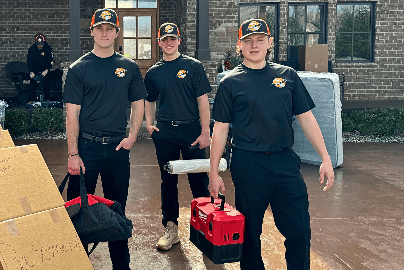 Moving crew posing with tools