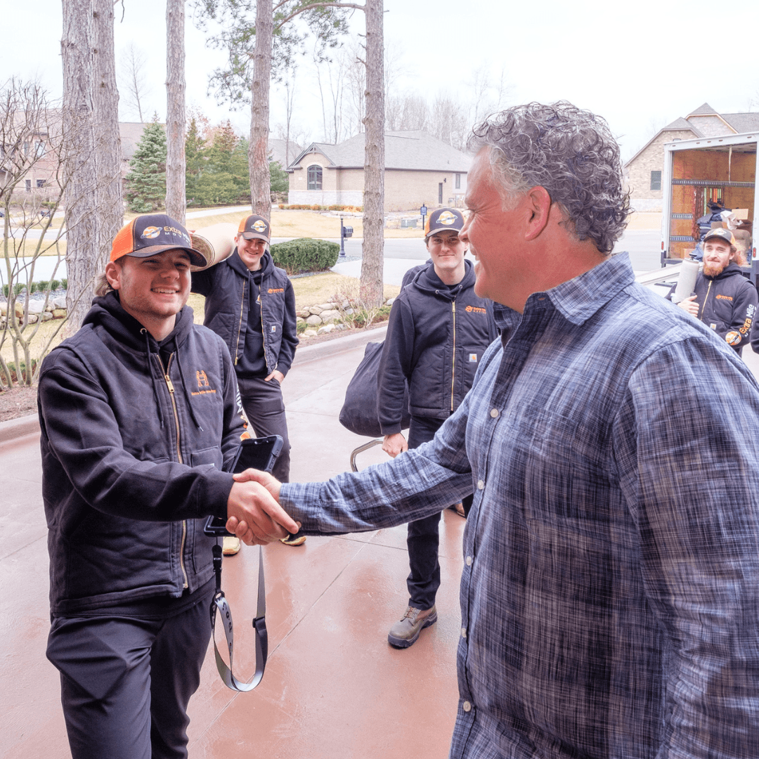 Professional movers carefully transporting furniture