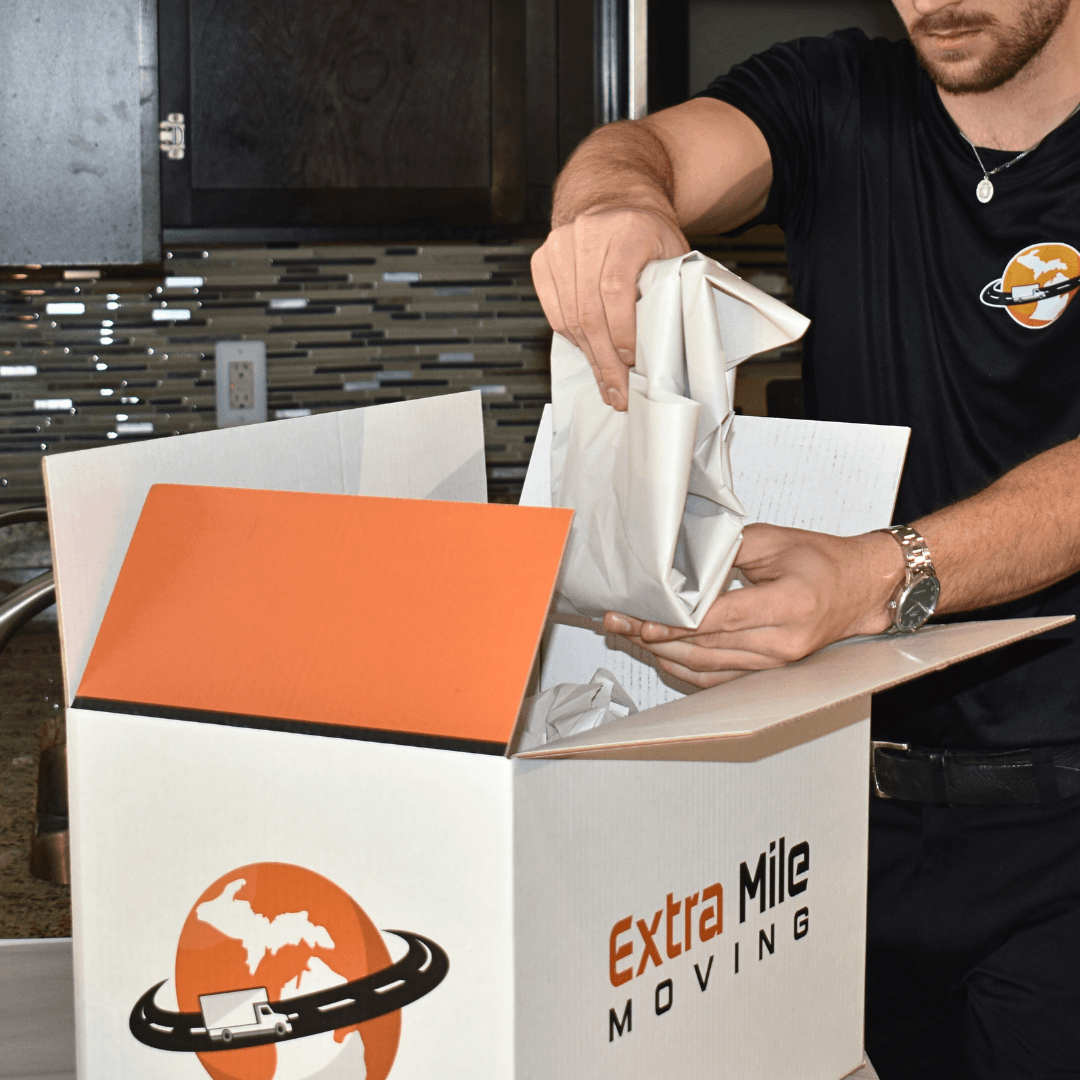 Expert handling of delicate items during packing